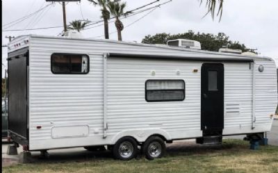 Photo of a 2002 Keystone Tail Gator 251 RR Pull Behind Travel Trailer for sale